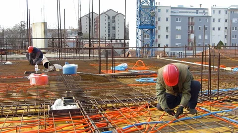 Construction workers installing reinforcement steel bars 動画素材 44756509