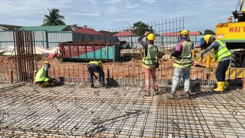 Construction Workers Installing Steel Rebar for Concrete Floor Slab Stock Footage 333497960