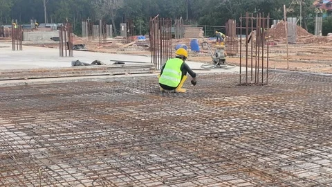 Construction Workers Installing Steel Rebar for Concrete Floor Slab Stock Footage 333498333