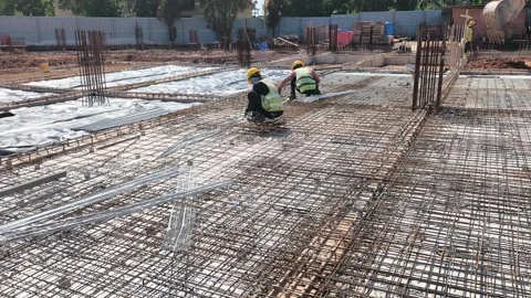 Construction Workers Installing Steel Rebar for Concrete Floor Slab Stock Footage 333498350