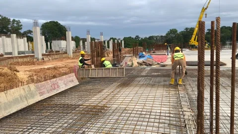 Construction Workers Installing Steel Rebar for Concrete Floor Slab Stock Footage 333498368