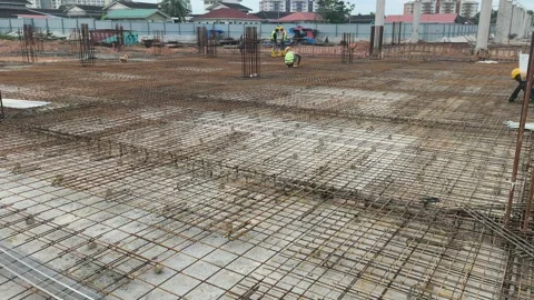 Construction Workers Installing Steel Rebar for Concrete Floor Slab Stock Footage 333498409
