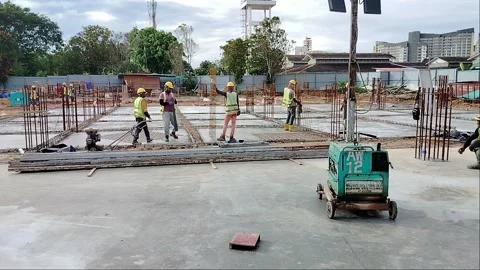 Construction Workers Installing Steel Rebar for Concrete Floor Slab Stock Footage 333498423