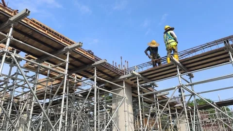 Construction Workers Installing Upper Floor Beam Reinforcement Bars Stock Footage 328150811