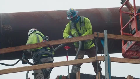 Construction workers lay concrete foundation Stock Footage 136807104