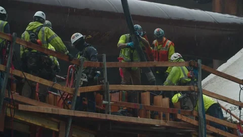 Construction workers lay concrete foundation Stock Footage 136807831