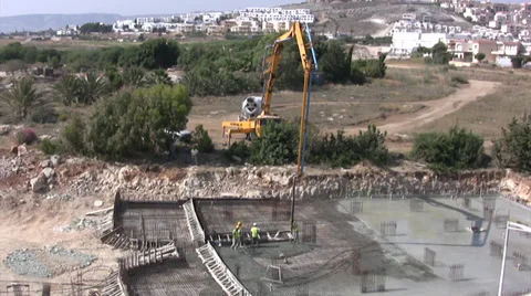 Construction workers laying concrete foundations on a building site Stock Footage 39858929