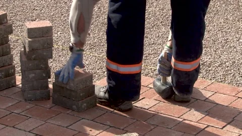 Construction workers laying concrete pavement on the street Stock Footage 234133066