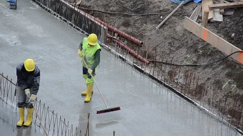 Construction workers laying down cement Stock Footage 40810863