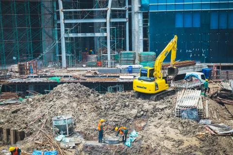 Construction workers with loading and digging are working Stock Photos