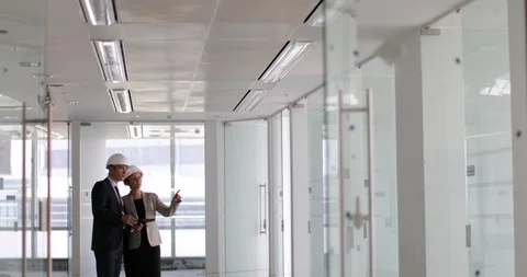 Construction workers looking at new office Stock Footage 88595101