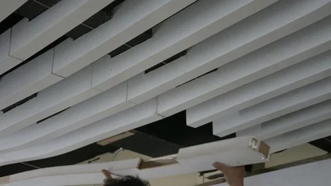 Construction workers make the ceiling whiite lath in construction interior site Stock Footage 83778981