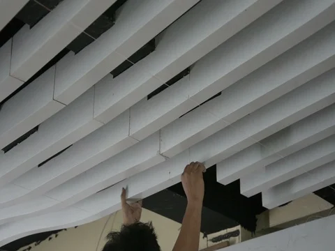 Construction workers make the ceiling whiite lath in construction interior site Stock Footage 83779367