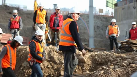 Construction workers with manager Stock Footage 77100146