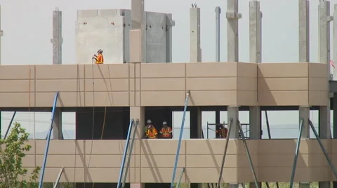 Construction workers measure precast concrete Stock Footage