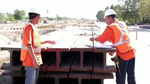 Construction workers measuring rail Stock Footage 11811084