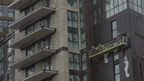 Construction workers on mobile platform Stock Footage 93202320