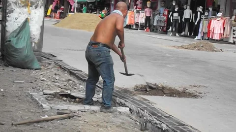 Construction workers in the pavement construction, excavation pit Stock Footage