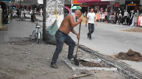 Construction workers in the pavement construction, excavation pit Stock Footage