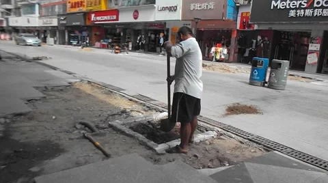Construction workers in the pavement construction, excavation pit Stock Footage 67745746