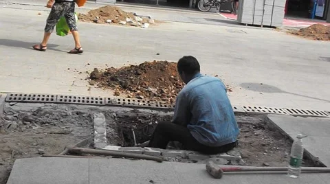Construction workers in the pavement construction, excavation pit Stock Footage 67745765