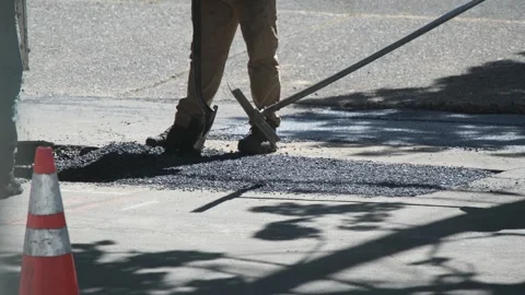 Construction Workers  paving the road in Portland Oregon USA May 1 2025 Stock Footage 307643785