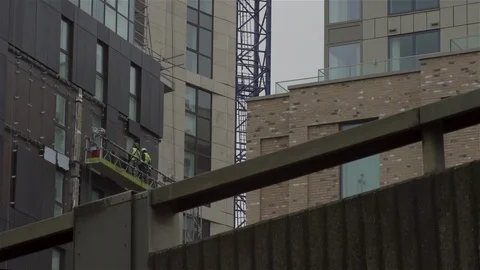Construction workers on platform Stock Footage 93202304