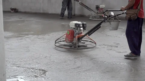 Construction workers polishing concrete surface at construction site. Stock Footage 107823645