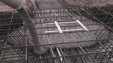 Construction workers pour a concrete foundation Stock Footage 22001413