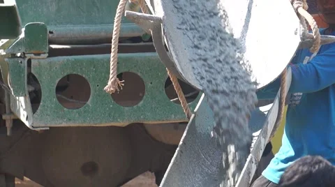 Construction workers pour concrete mix from cement mixer, Preparation of constru Stockbeeldmateriaal 62519953