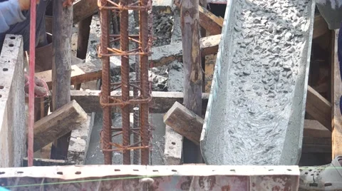Construction workers pour concrete mix from cement mixer, Preparation of constru Stock Footage 62520214