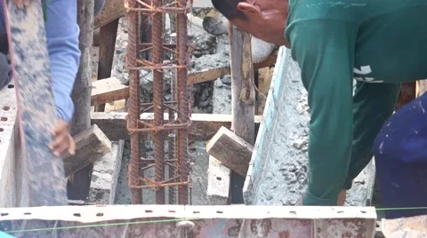 Construction workers pour concrete mix from cement mixer, Preparation of constru Stock Footage 62520462