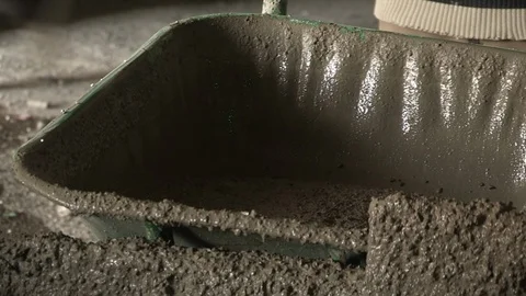 Construction workers pouring concrete into form 库存影片 98761888