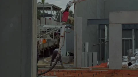 Construction Workers Pouring Concrete Slab in Slow Motion Industrial Build Stock Footage 305107534
