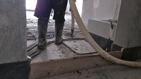 Construction workers pouring lightweight polystyrene concrete floor Stock Footage 339364037