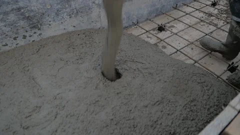 Construction workers pouring wet concrete using crane or concrete pump crane Stock Footage 161975171