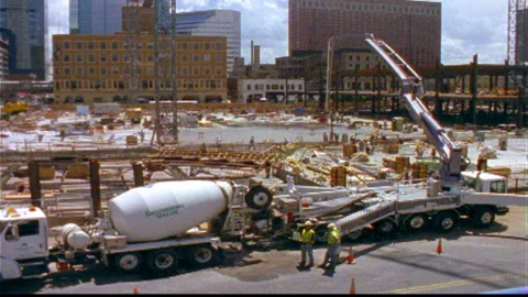 Construction workers pump cement normal speed Stock Footage 145799535