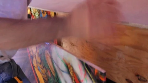 Construction workers put together paint art on the side wall of a bar 스톡 동영상 125057128