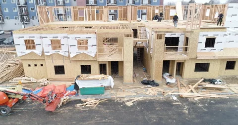 Construction workers putting an apartment building together Stock Footage 151870342