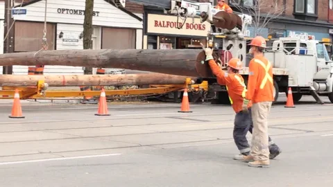 Construction workers putting up pole Stock Footage 69187829
