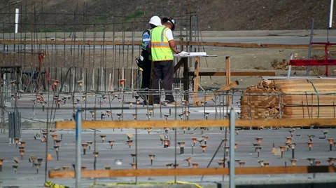 Construction workers read documentation development site Stock Footage 34506183