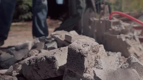 Construction workers removing debris in slow motion Stock Footage 345551069