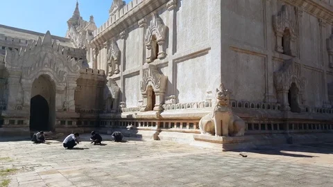 Construction workers repair courtyard ground at Ananda Temple compound,, Bagan Video stock 78661538