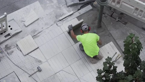 Construction workers repairing a sidewalk Video stock 139484971