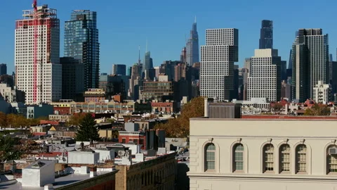 Construction workers restore a rooftop on a Brooklyn building, enhancing urban Video stock 302185512