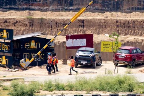 Construction workers returning to a real estate development project as the re Stock Photos
