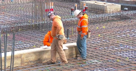 Construction Workers Review Plans - 4k Stock Footage 60405443