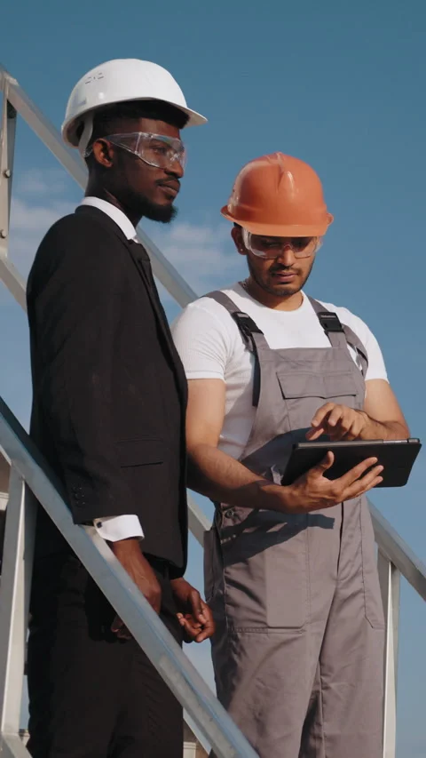 Construction Workers Reviewing Plans Stock Footage 318649493