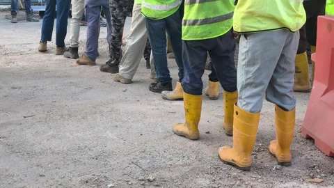 Construction Workers in Safety Boots Standing on Site Facing One Direction Stock Footage 342479741