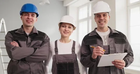 Construction workers in safety helmets, professional renovation crew portrait Stock Footage 337313937